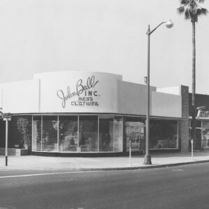 black and white store front on street corner